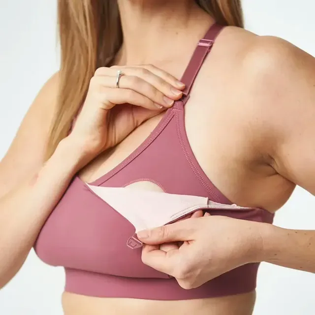 Nursing bra with a nickel-free clip being opened for feeding