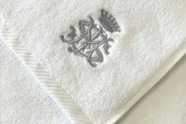 Embroidered logo detail on a towel