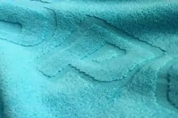 Yarn-dyed jacquard woven towel logo