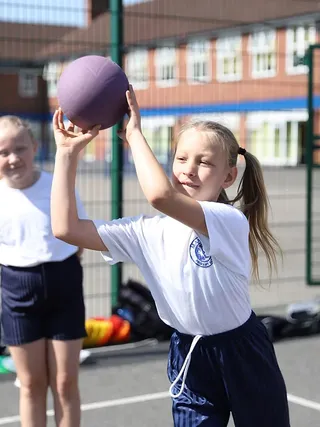 Primary school students in uniform on playground