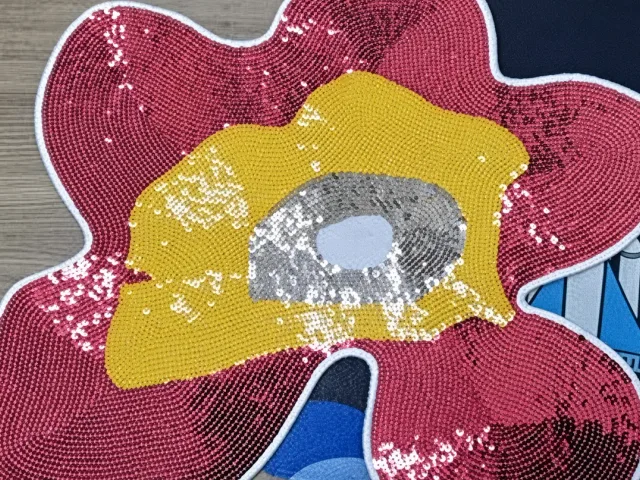 Sequin embroidery with a metallic, glam finish