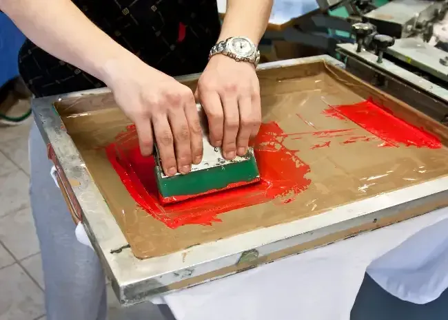 Screen printing a bold logo onto fabric