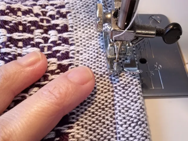 Sewing and reinforcement — twin-needle hem and reinforced corner guards